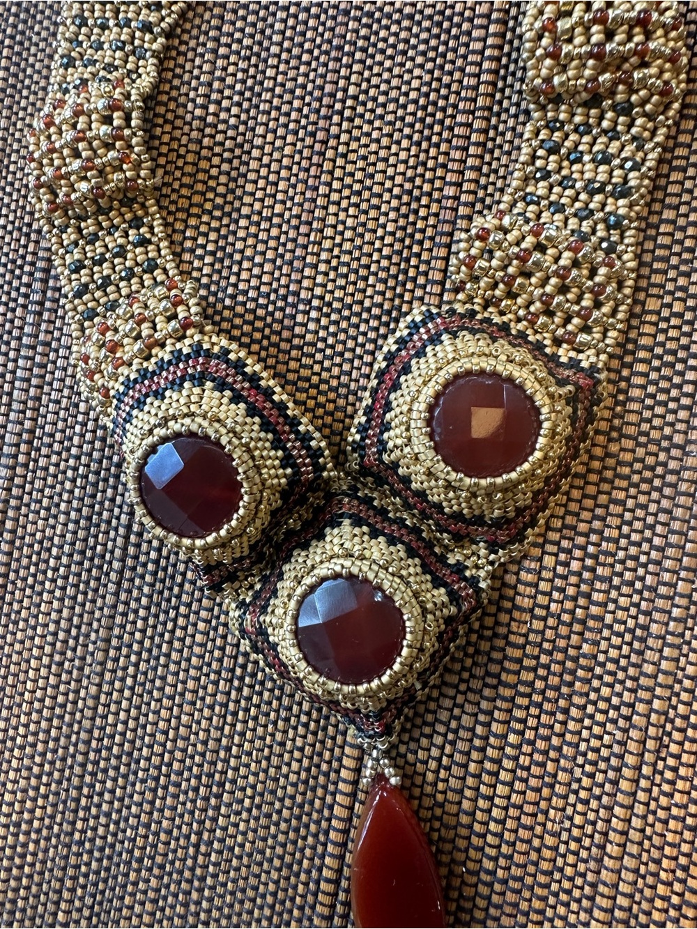 Gold Beaded Necklace with Deep Red Gem Accents